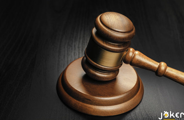 wooden-mallet-black-wooden-table-close-up_93675-70852